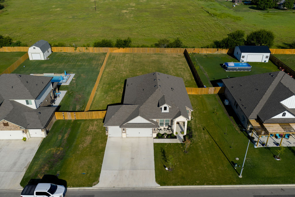 213 Gauge Road Thorndale, TX 76577 - Photo 7 of 40 an aerial view of a house with a garden