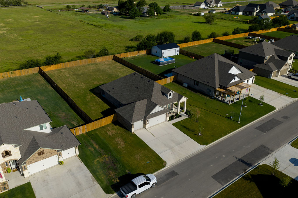 213 Gauge Road Thorndale, TX 76577 - Photo 8 of 40 an aerial view of a house having yard