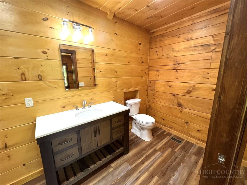 138 Talon Drive Boone, NC 28607 - Photo 14 of 25 a bathroom with a sink mirror vanity and toilet