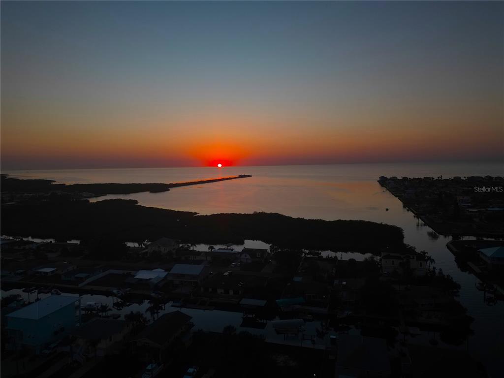 6814 Gull Lane Hudson, FL 34667 - Photo 7 of 51 a sunset view with a lake