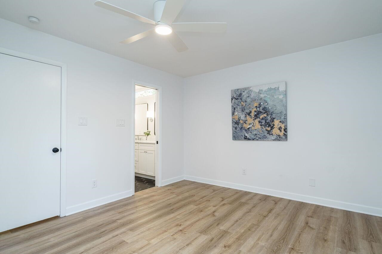 1436 Princess Anne Road Raleigh, NC 27607 - Photo 21 of 36 an empty room with wooden floor and closet