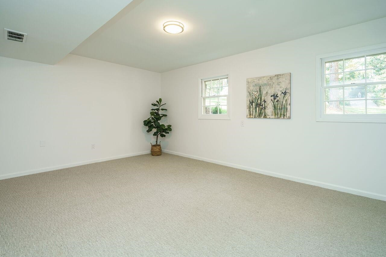 1436 Princess Anne Road Raleigh, NC 27607 - Photo 31 of 36 an empty room with windows