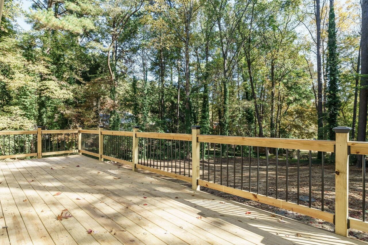 1436 Princess Anne Road Raleigh, NC 27607 - Photo 32 of 36 a view of a balcony with floor to ceiling window and wooden fence