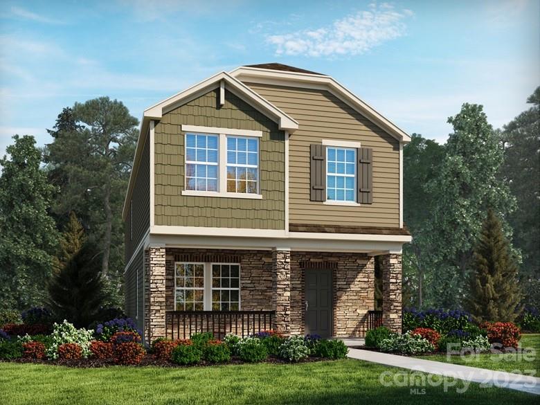 a view of a house with yard and green space