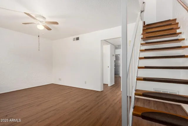 a view of entryway with wooden floor