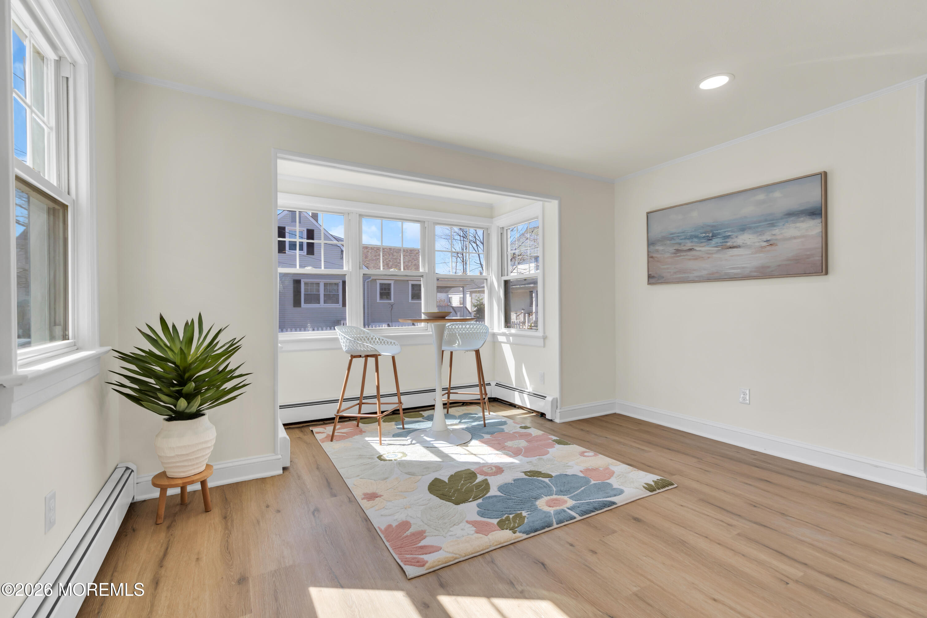 137 Inskip Avenue Ocean Grove, NJ 07756 - Photo 12 of 39 a living room with a couch and a potted plant