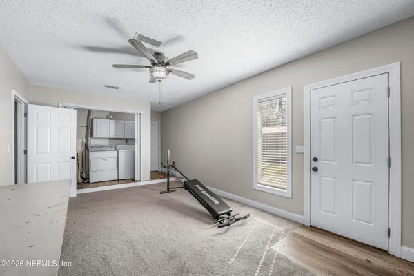 a view of a bedroom with cabinet and cabinet