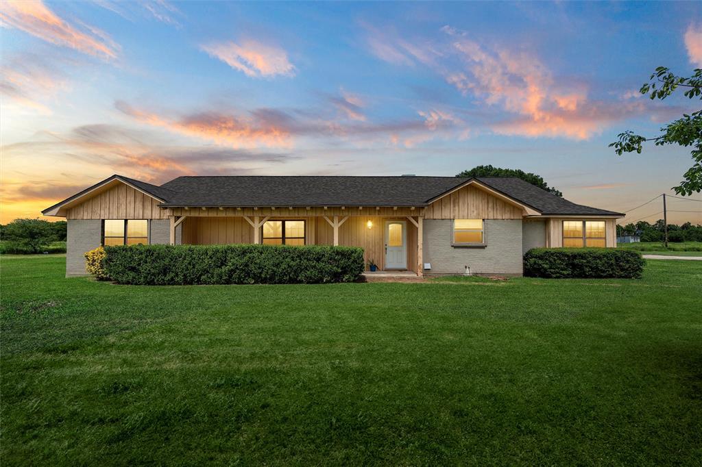 11307 China Spring Road Waco, TX 76708 - Photo 1 of 1 a front view of a house with a yard and garage