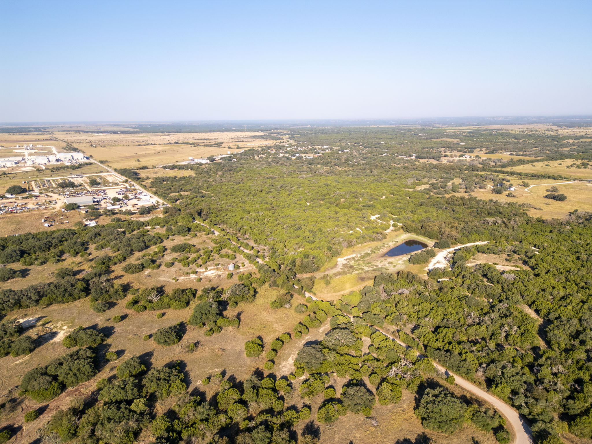 112 Loop 308 Briggs, TX 78608 - Photo 14 of 37 View of property location with a forest