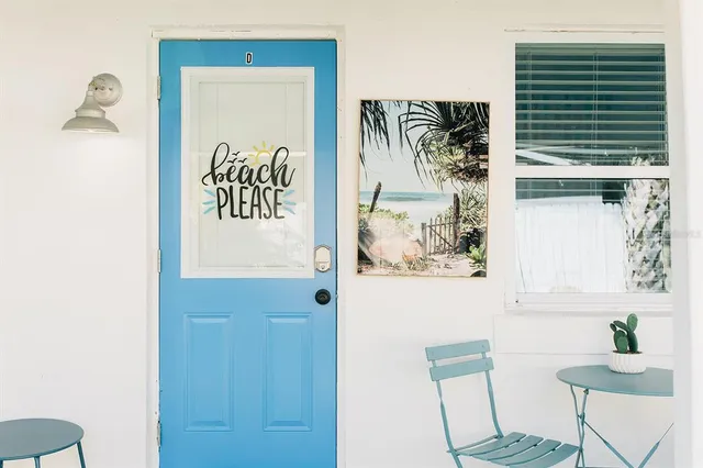 a bathroom with a bathtub and a window