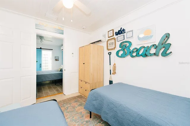 a bedroom with a bed and a view of bathroom