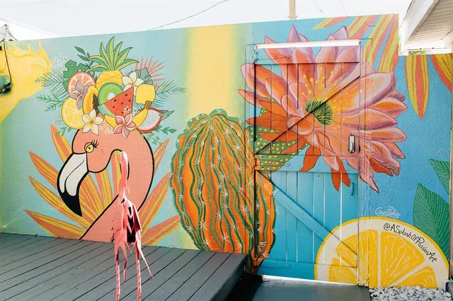 a view of a painting on the wall and a wooden floor