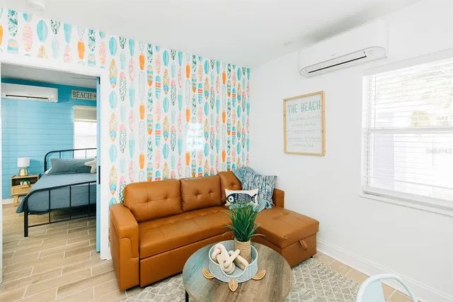 a living room with furniture and a window