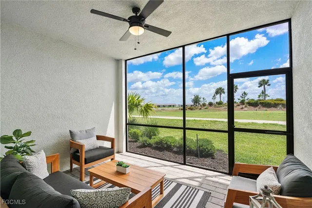 a view of a big yard with plants and large tree
