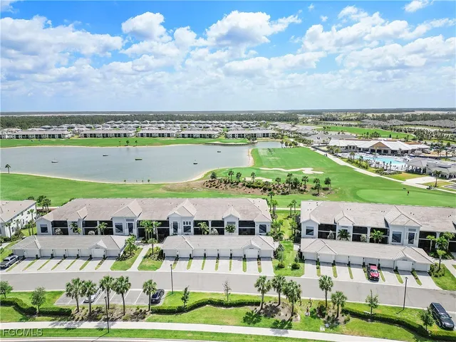a view of swimming pool with outdoor space and lake view