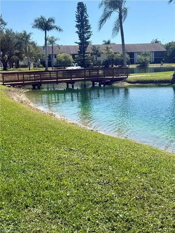 a view of swimming pool with a yard