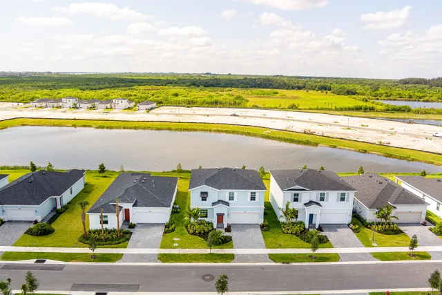 a view of houses with swimming pool
