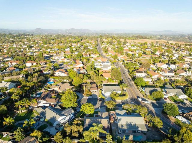 an aerial view of residential building with parking space