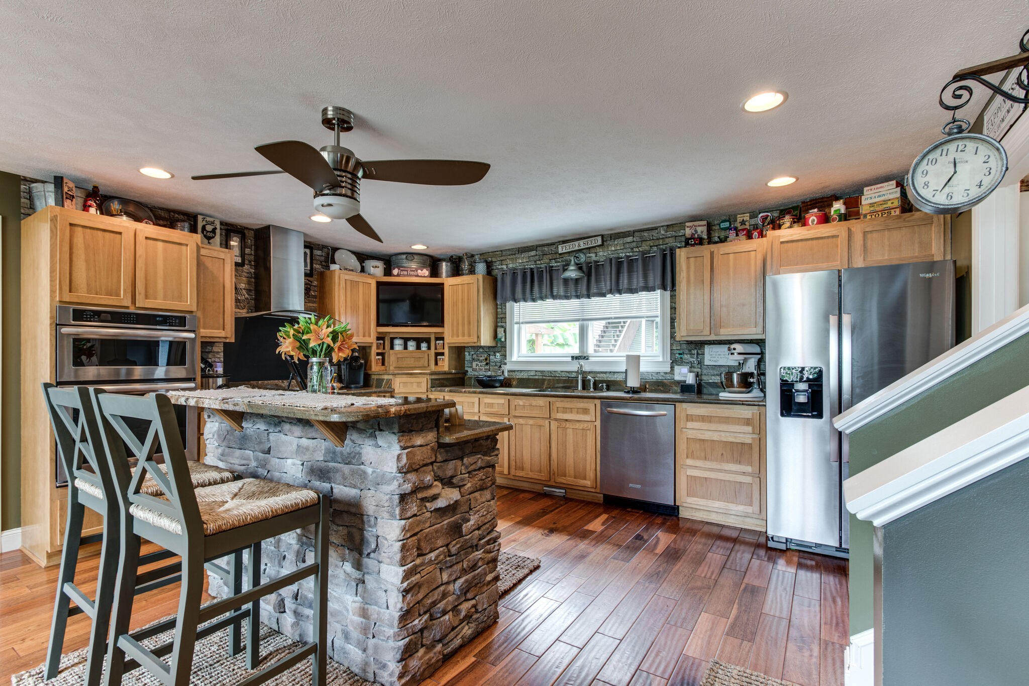 67 Cedar Bend Road Beechgrove, TN 37018 - Photo 12 of 48 a kitchen with stainless steel appliances granite countertop a stove and a wooden floors