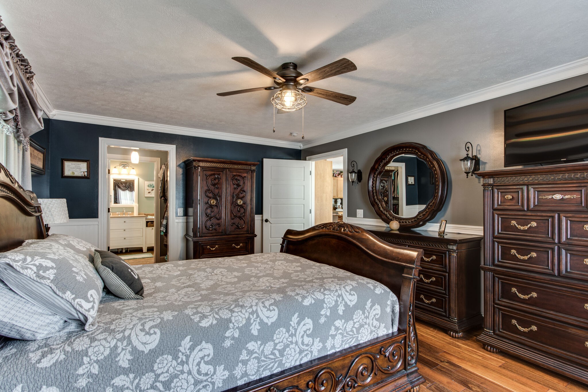 67 Cedar Bend Road Beechgrove, TN 37018 - Photo 20 of 48 a bedroom with a bed and a chandelier