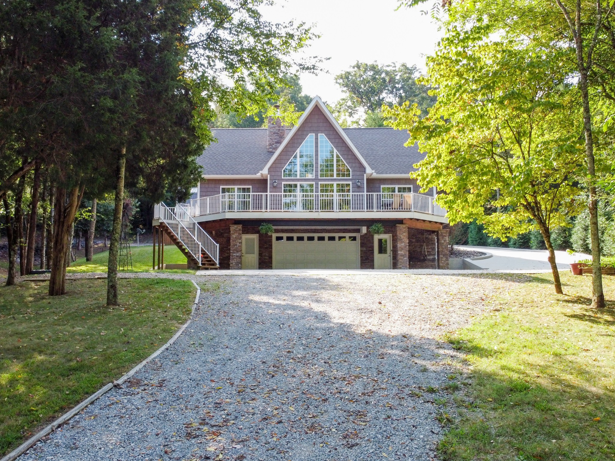 67 Cedar Bend Road Beechgrove, TN 37018 - Photo 2 of 48 a front view of a house with a yard and trees