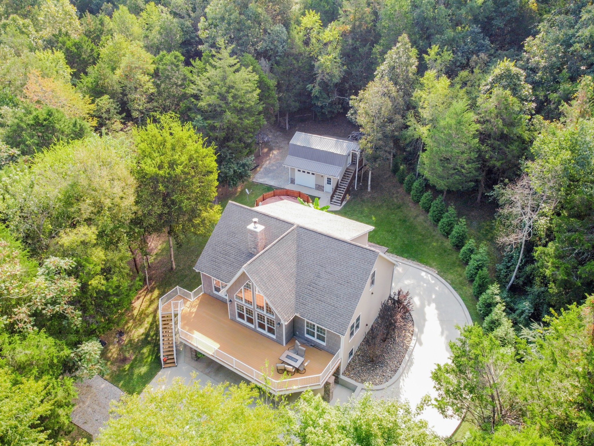 67 Cedar Bend Road Beechgrove, TN 37018 - Photo 48 of 48 an aerial view of a house with outdoor space and trees all around