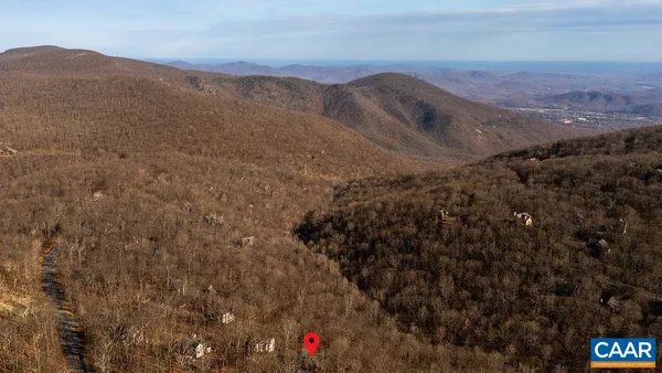 a view of mountains and valleys