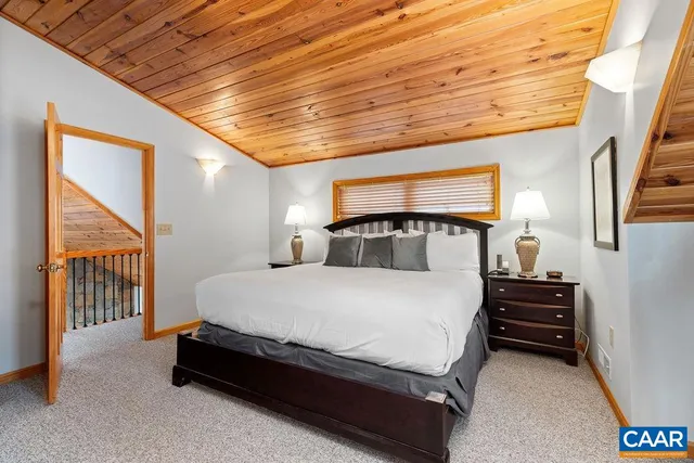 a view of room with flat screen tv and refrigerator