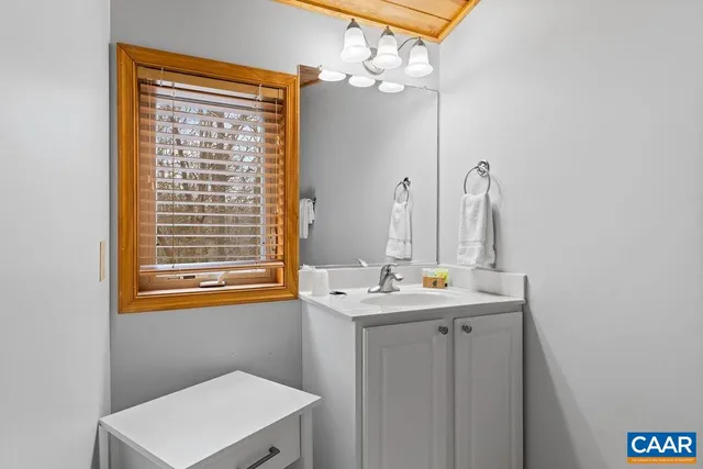 a bathroom with a shower curtain and a tub