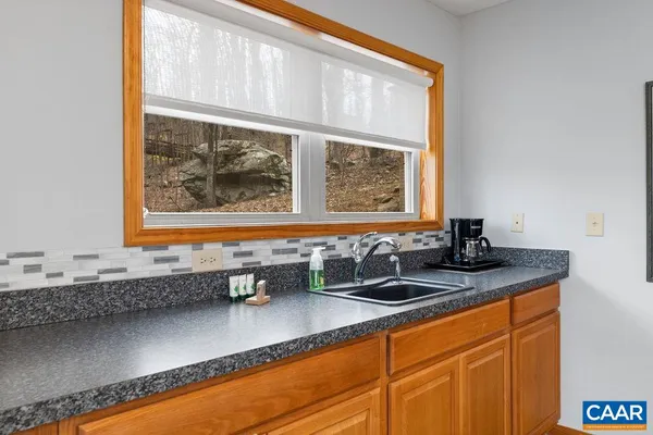 a view of a livingroom with furniture and window