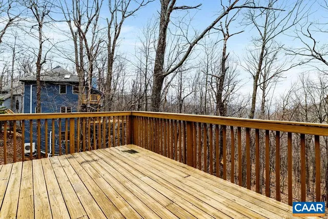 a view of a balcony with wooden floor
