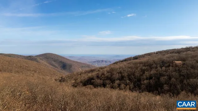 a view of a mountain from a yard