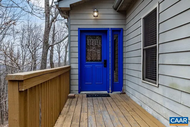a view of wooden house with a large window
