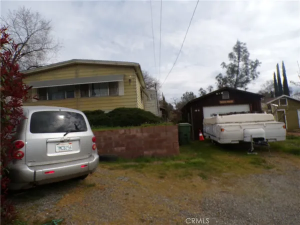 a view of a car in front of a house