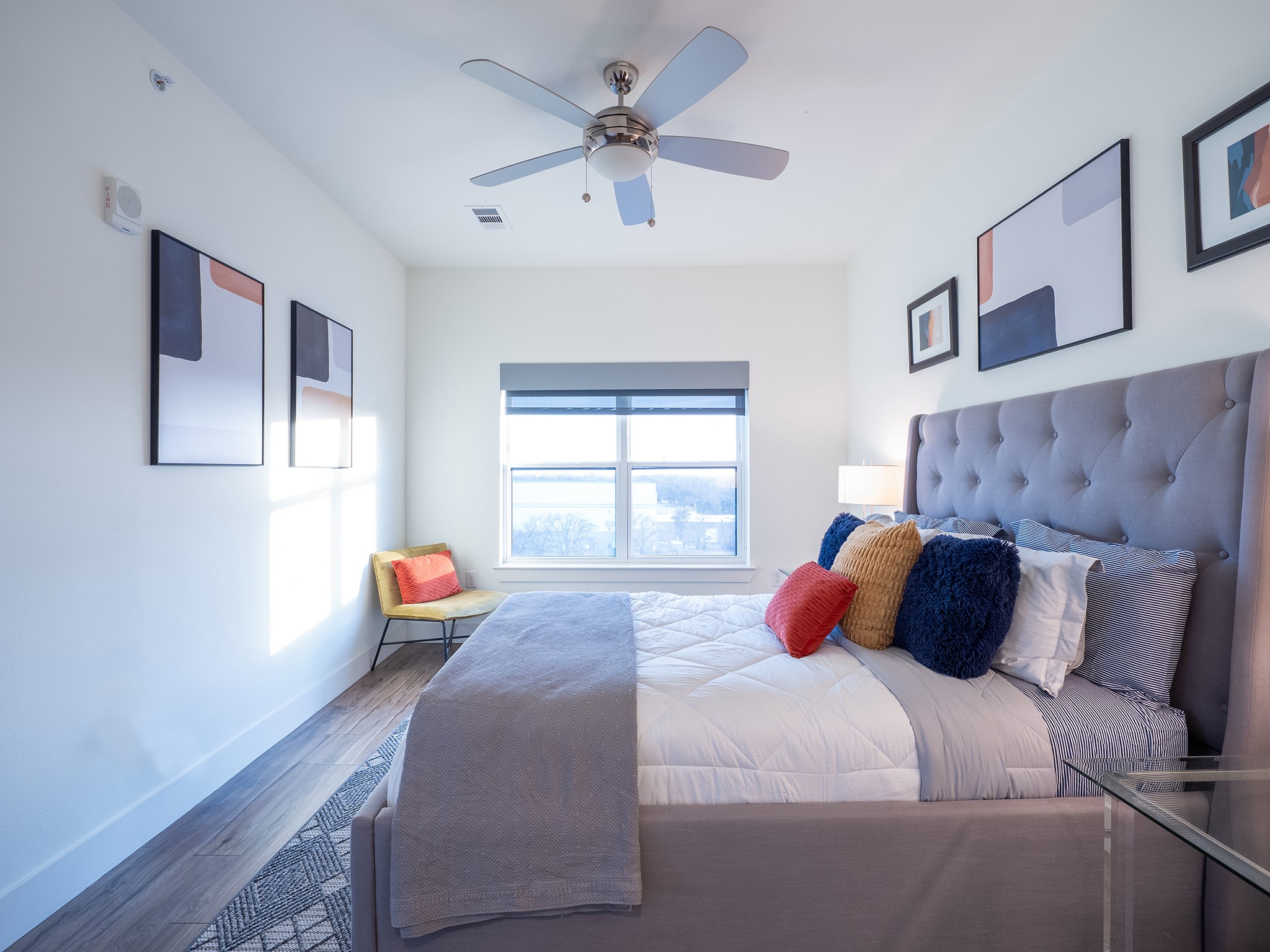 6444 Burnet Road, Unit 509 Austin, TX 78757 - Photo 16 of 32 Natural light bathes this comfortable bedroom, featuring stylish wood flooring and ample ceiling height.