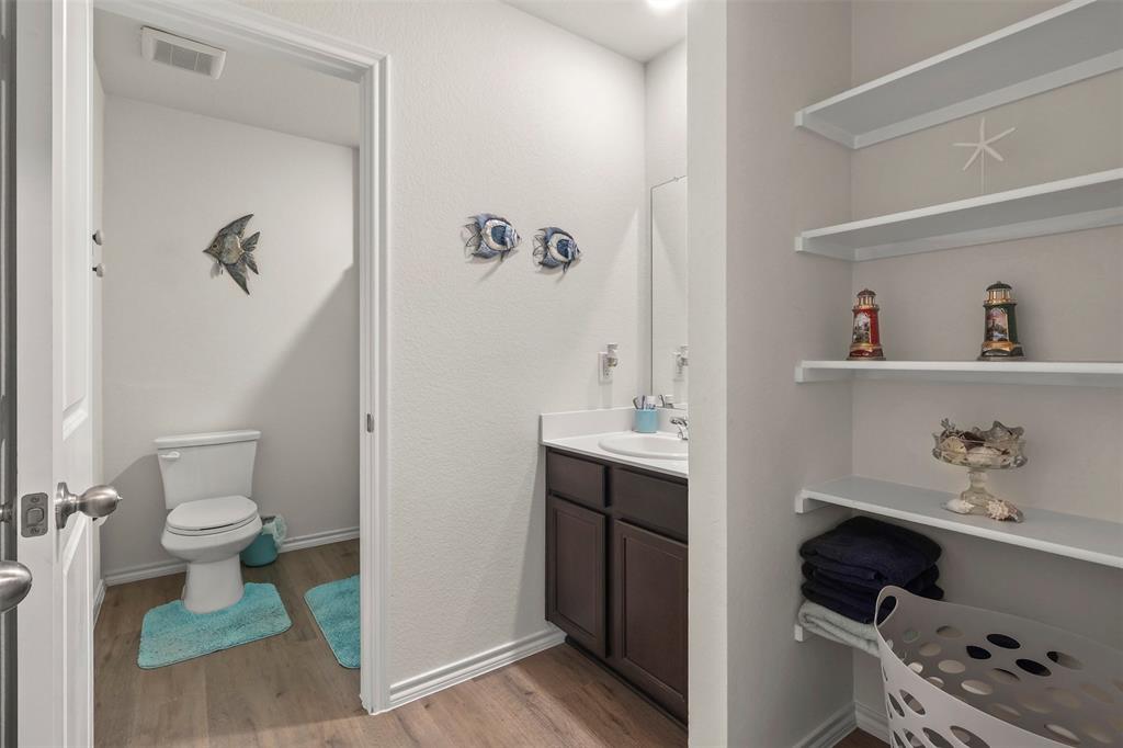 742 Buttercup Drive Pilot Point, TX 76258 - Photo 17 of 20 Bathroom with light wood finished floors and vanity