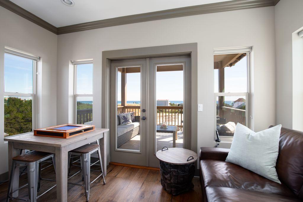 46 Eagles Landing Inlet Beach Inlet Beach, FL 32461 - Photo 21 of 40 a living room with furniture a table and a large window