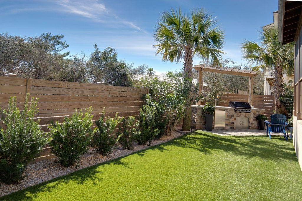 46 Eagles Landing Inlet Beach Inlet Beach, FL 32461 - Photo 22 of 40 a view of a backyard with plants and palm tree