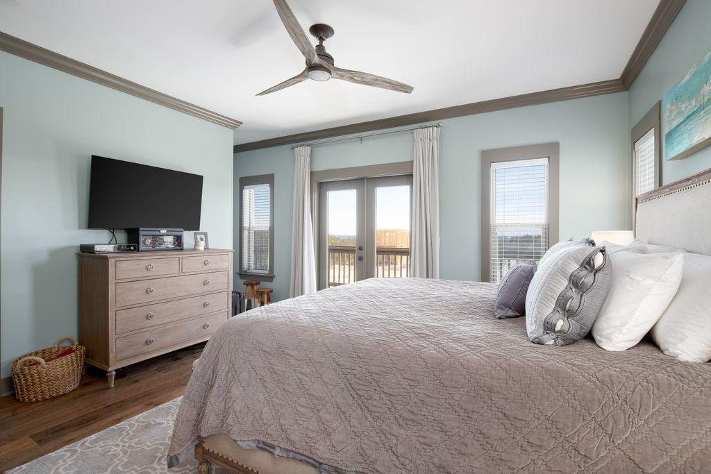 46 Eagles Landing Inlet Beach Inlet Beach, FL 32461 - Photo 26 of 40 a bedroom with a large bed and a flat tv screen on dresser