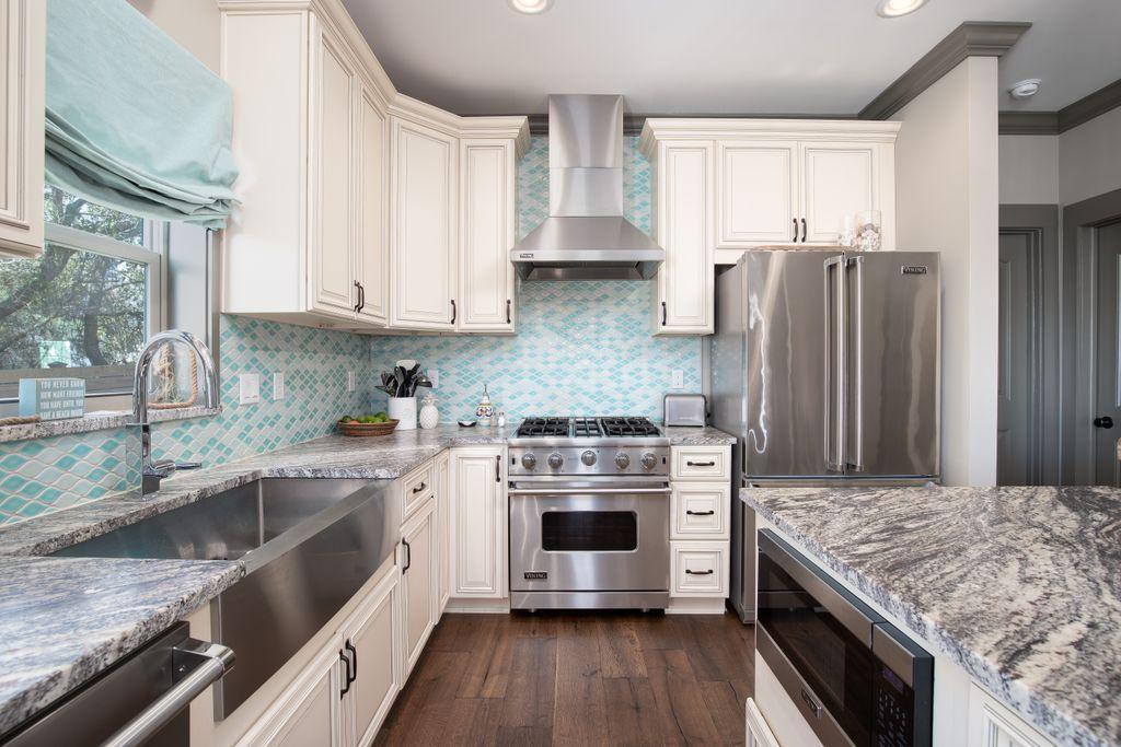 46 Eagles Landing Inlet Beach Inlet Beach, FL 32461 - Photo 3 of 40 a kitchen with stainless steel appliances granite countertop a stove and a refrigerator