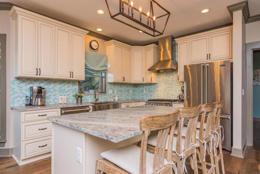 46 Eagles Landing Inlet Beach Inlet Beach, FL 32461 - Photo 5 of 40 a kitchen with granite countertop a sink a center island stainless steel appliances and cabinets