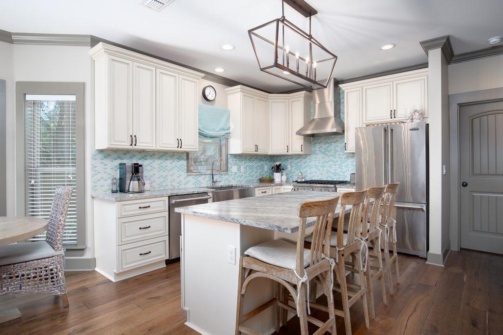 46 Eagles Landing Inlet Beach Inlet Beach, FL 32461 - Photo 8 of 40 a kitchen with stainless steel appliances granite countertop a white cabinets and wooden floor
