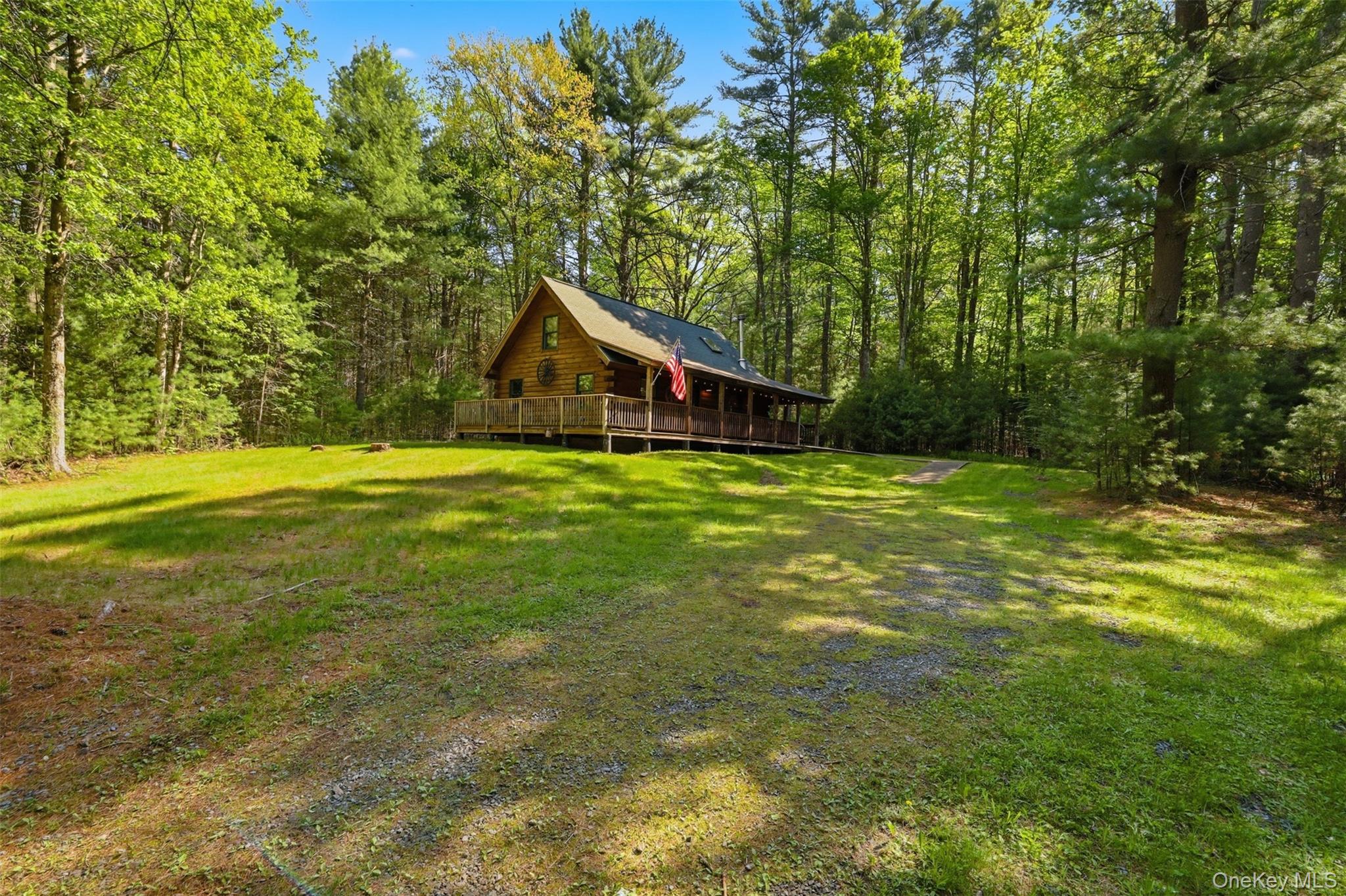 301 Pucky Huddle Road Bethel, NY 12720 - Photo 2 of 39 Come for peace and pines. This beautiful log home is turn key, stylishly decorated and setup with all the modern amenities needed for your Catskill escape.