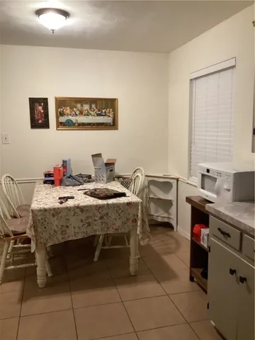 a bedroom with a bed and a desk