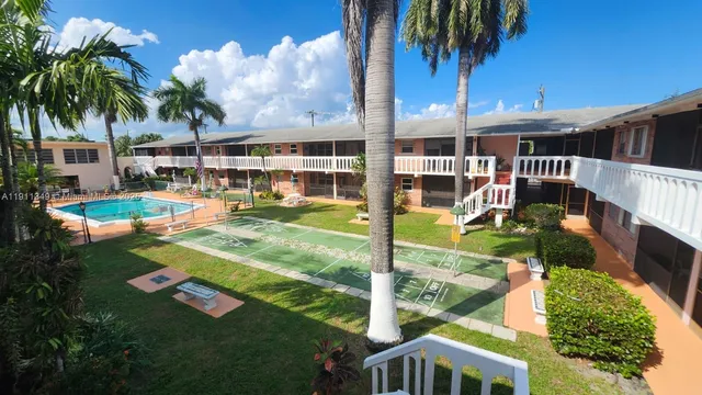 a view of a swimming pool with a patio