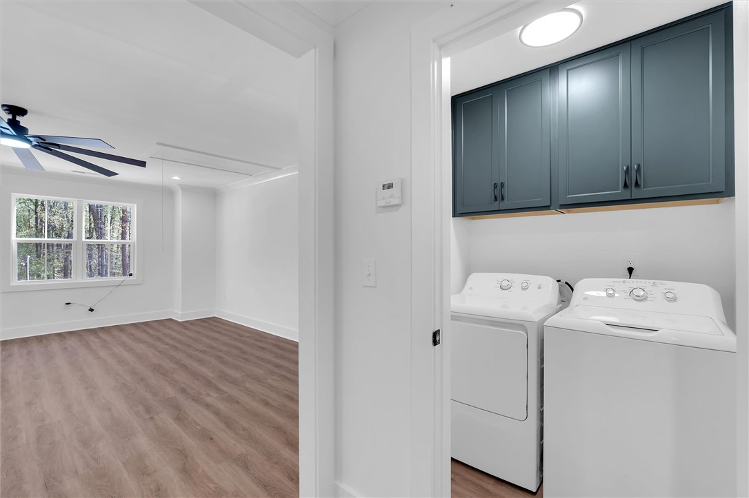 407 Blue Ridge Court Westminster, SC 29693 - Photo 35 of 48 on the second floor This bright space features sleek flooring and a dedicated laundry area with overhead cabinetry.
