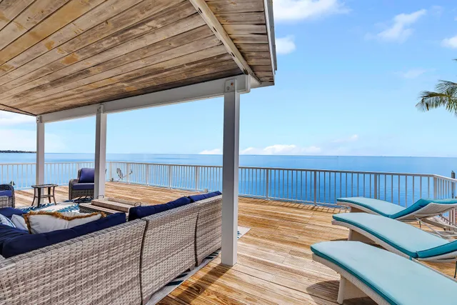 a bed room with furniture and window