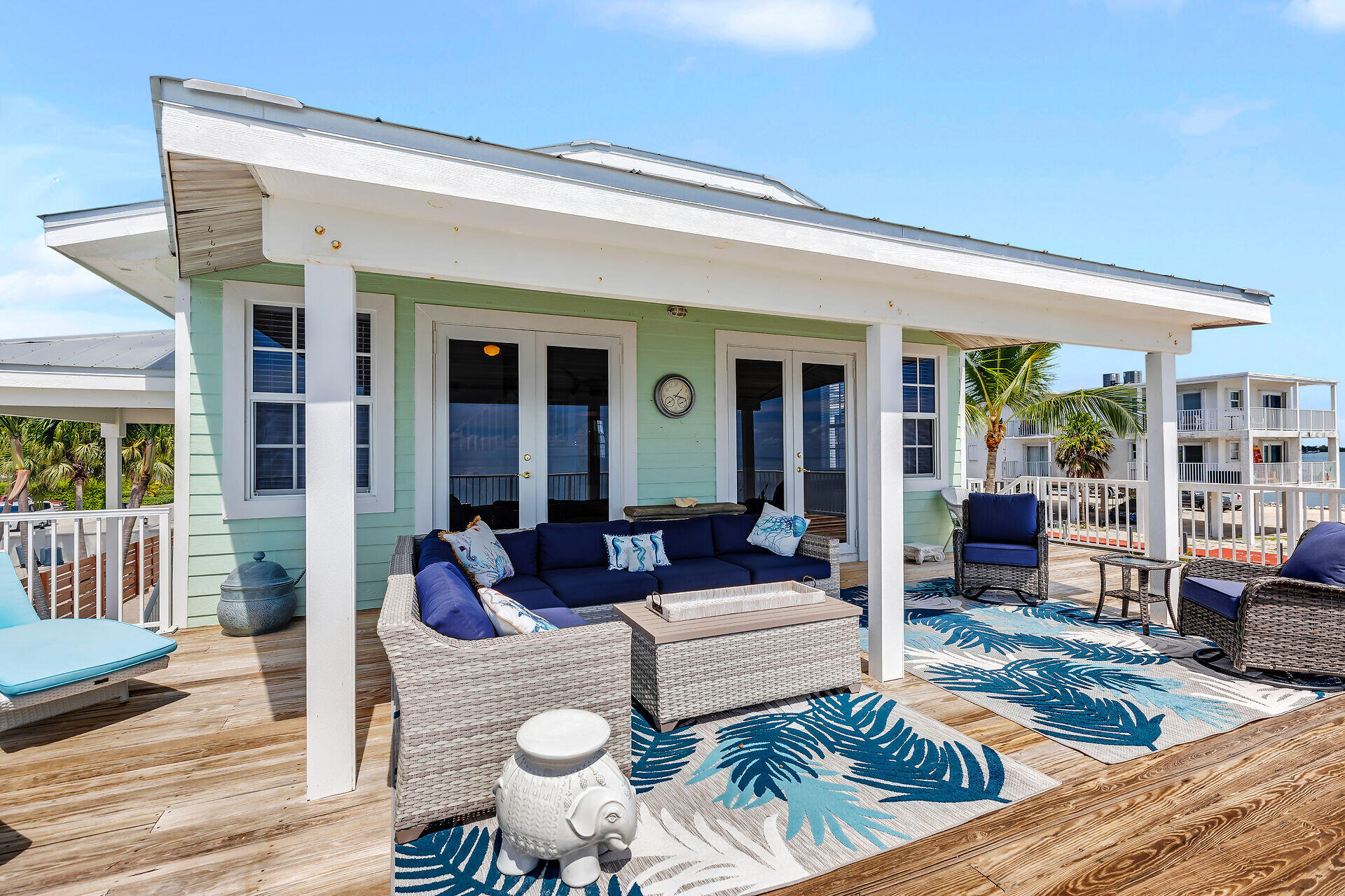 996 97th Street Marathon, FL 33050 - Photo 15 of 52 a outdoor space with patio the couches and a dining table with garden view