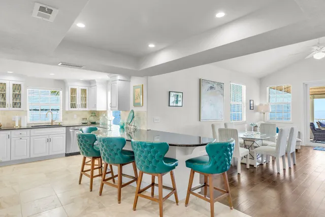 a living room with furniture dining table and wooden floor