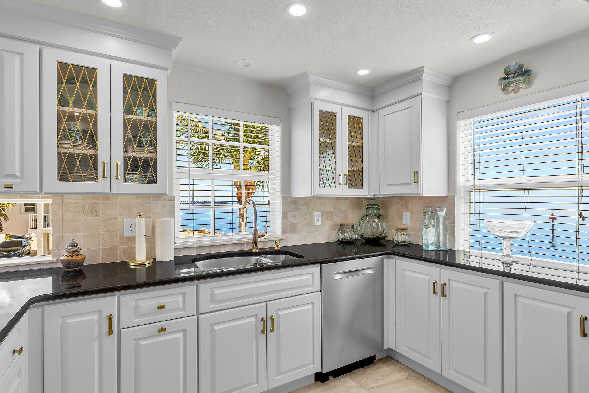 996 97th Street Marathon, FL 33050 - Photo 20 of 52 a kitchen with granite countertop white cabinets and sink